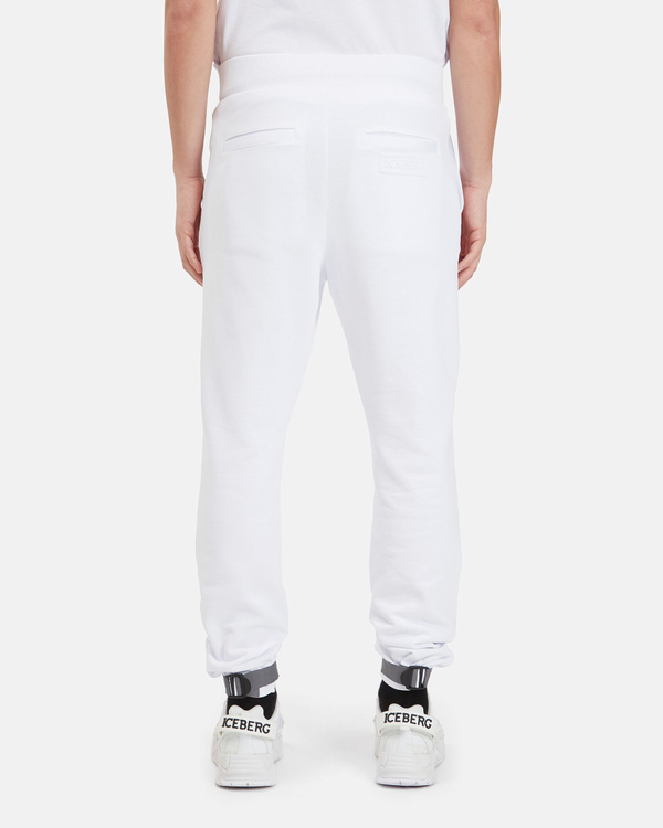 Pantaloni sportivi uomo bianchi con chiusura in velcro e fondo gamba con patch logato - Iceberg - Official Website