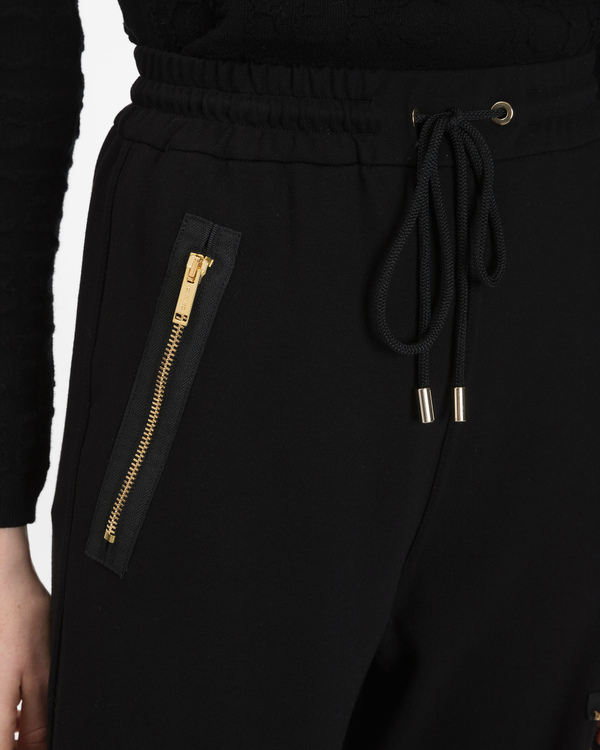 Pantaloni sportivi donna neri con zip dorate e fondo gamba a costa rigato - Iceberg - Official Website