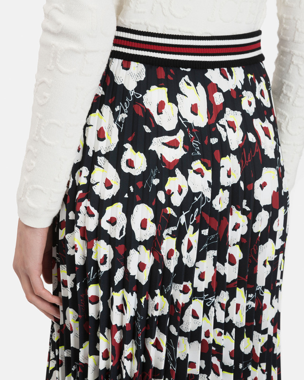 Women's midi pleated skirt with abstract flower pattern over black - Iceberg - Official Website