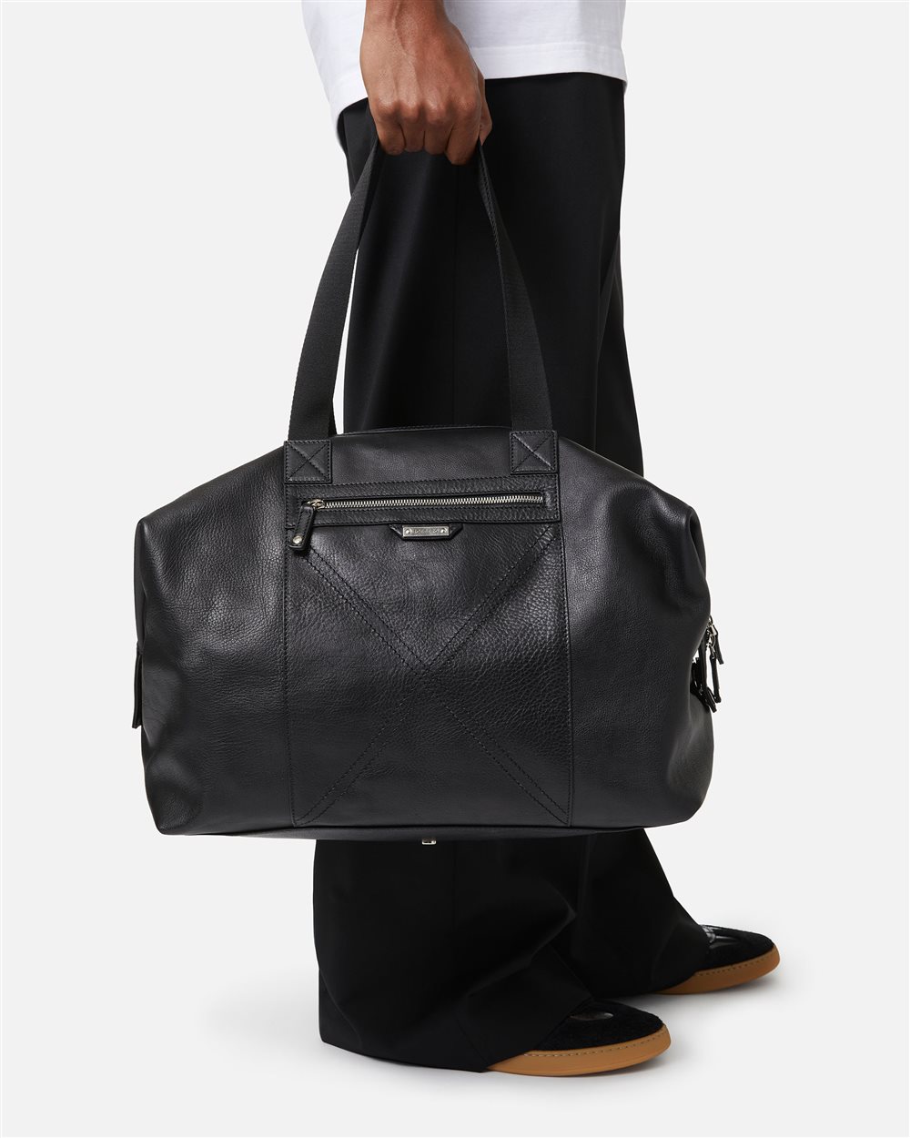 Black leather duffel bag with cross-stitching and logo plaque - Iceberg - Official Website