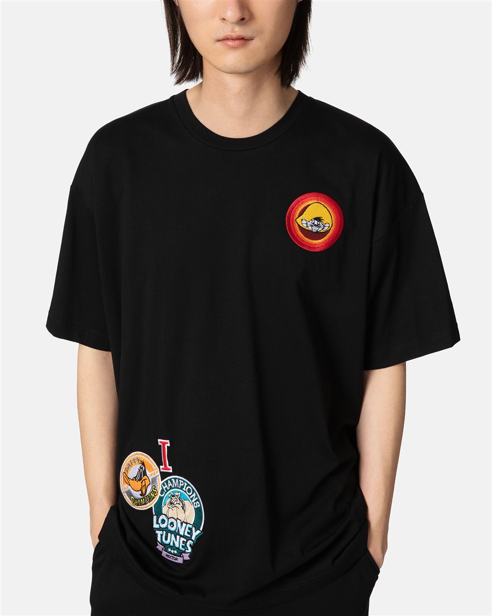 Black T-shirt with cartoon patch and logo