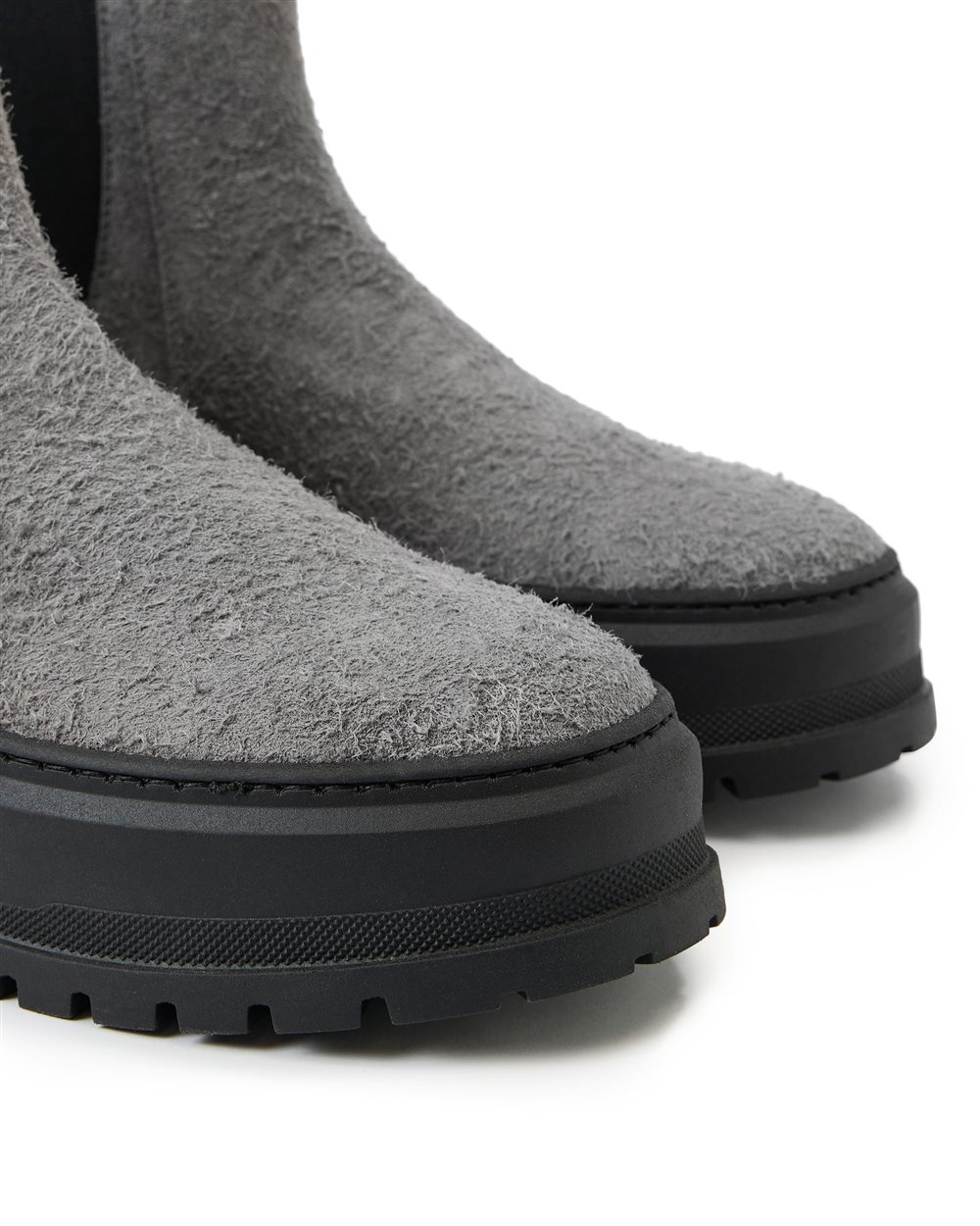 Grey suede ankle boot with elastic sides and stud details